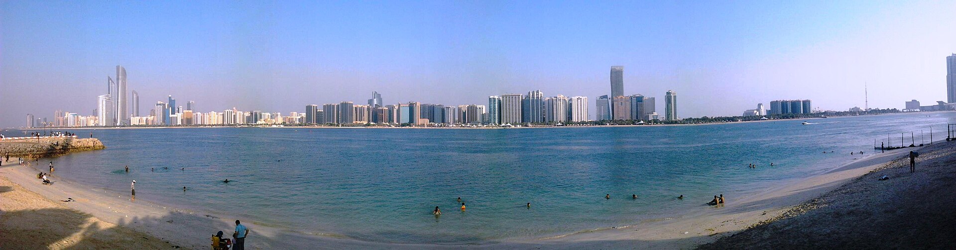 Panoramic view of the Corniche beach with Abu Dhabi skyline behind